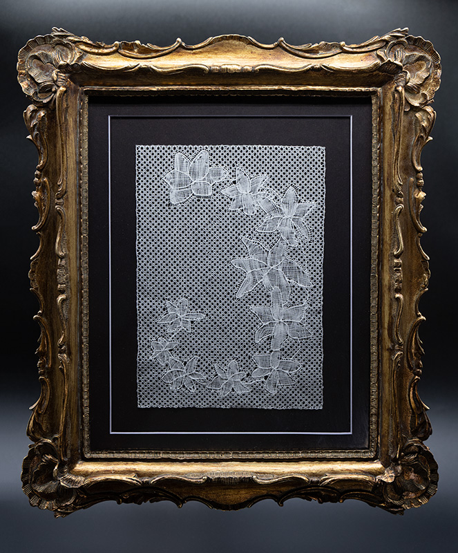 Utopia Flanders bobbin lace in a pristine ornate gold frame.