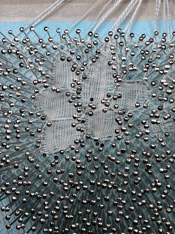 Correctly worked dense cloth stitch flower in Reality Torchon lace.