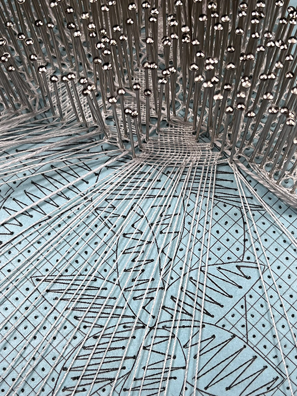 Close-up of an intentionally imperfect cloth stitch flower in Disillusion.