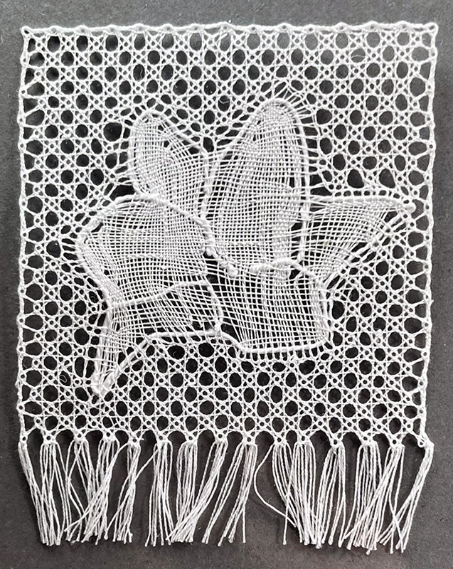 Completed Flanders bobbin lace flower sample for Utopia.