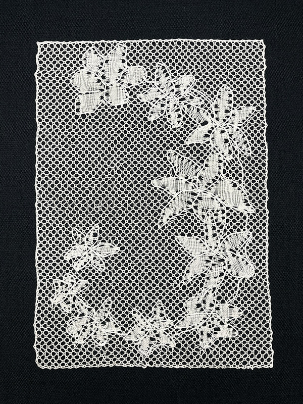 Completed Disillusion floral Torchon bobbin lace artwork.